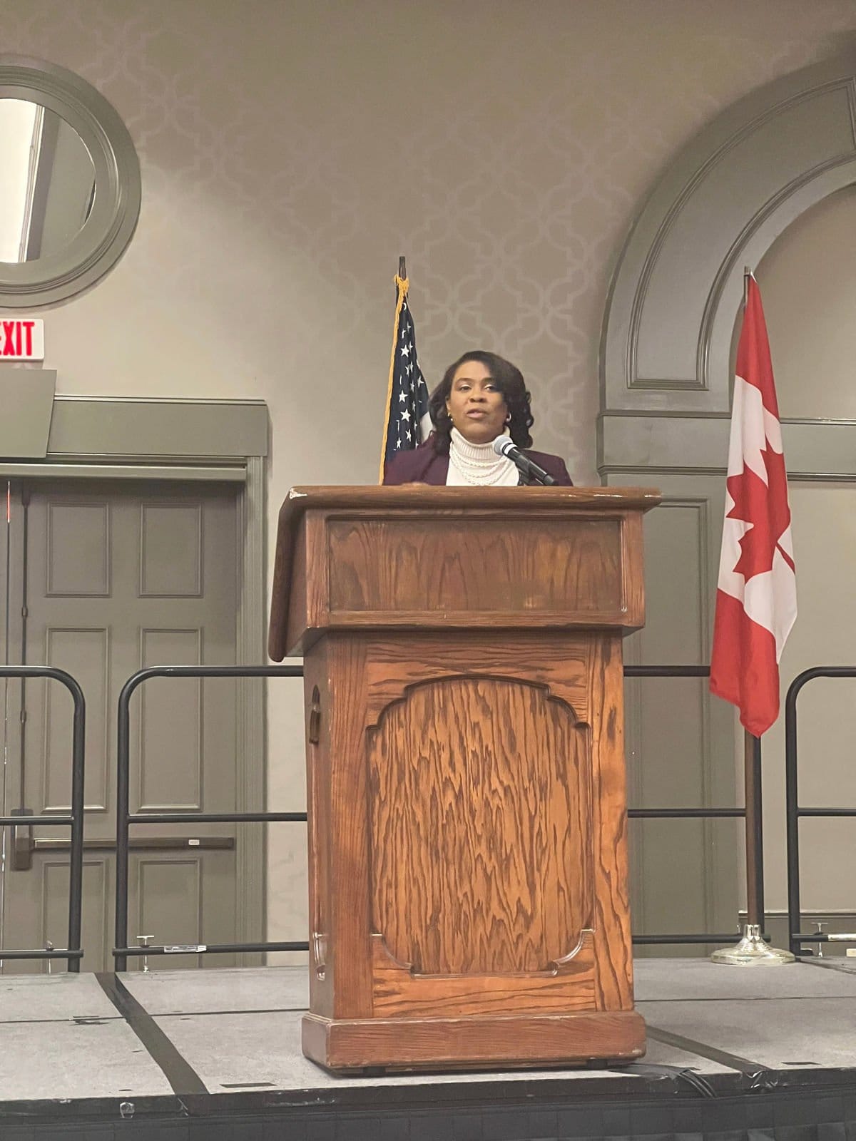 Ashley Smith speaking at a podium